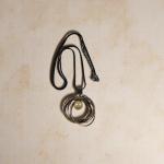 Abstract Swirl Pendant Necklace – Black Cord with Metallic Rings & Pearl Drop